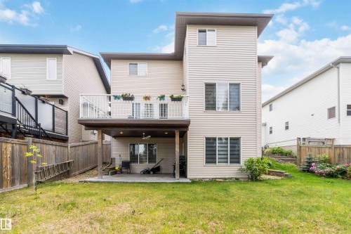 Beige vinyl siding exterior featuring multiple windows with blinds - 6116 53 Avenue, Beaumont, AB - Outdoor With Exterior