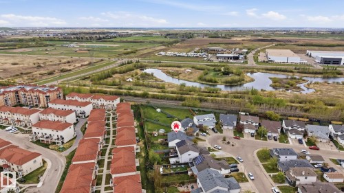 Aerial view showcasing residential properties, a winding water feature, and expansive green spaces - 14017 156 Avenue, Edmonton, AB - Outdoor With View