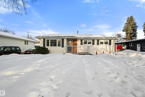 The property features a ranch-style exterior with white siding and dark window shutters - 3 Sorrel Crescent, St. Albert, AB - Outdoor