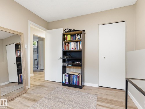 Room featuring light wood-finish flooring, neutral wall tones, and white trim - 18627 62A Avenue, Edmonton, AB - Indoor Photo Showing Other Room