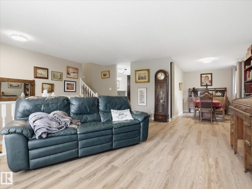 Open-concept living area featuring wood-finish flooring throughout - 18627 62A Avenue, Edmonton, AB - Indoor Photo Showing Living Room