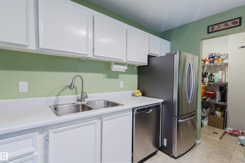 15017 26 Street, Edmonton, AB - Indoor Photo Showing Kitchen With Double Sink