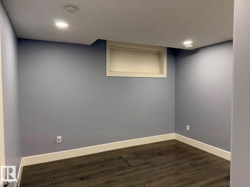 Room featuring recessed lighting, dark wood-finish flooring, and light blue walls - 648 178 Street, Edmonton, AB - Indoor Photo Showing Other Room