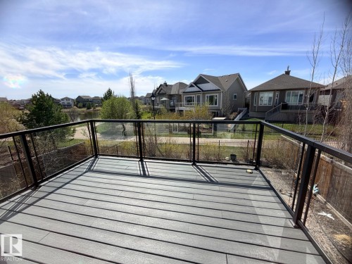 Expansive deck featuring composite decking and glass panel railings - 648 178 Street, Edmonton, AB - Outdoor