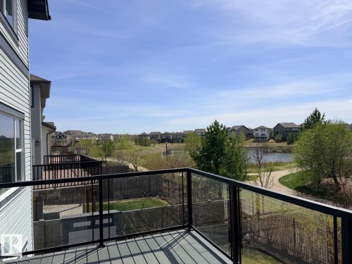 Elevated deck featuring composite decking and glass panel railings - 648 178 Street, Edmonton, AB - Outdoor