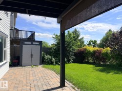 Covered patio with string lights and a paver patio surface - 