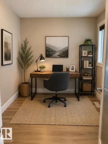 Dedicated room featuring wood-finish flooring, neutral wall tones, and white baseboards - 648 178 Street, Edmonton, AB - Indoor Photo Showing Office