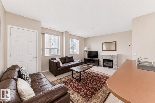 601 9919 105 Street, Edmonton, AB - Indoor Photo Showing Living Room With Fireplace