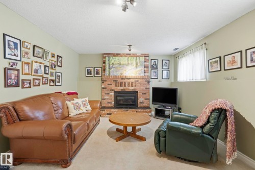 210 Porter Avenue, Millet, AB - Indoor Photo Showing Living Room With Fireplace