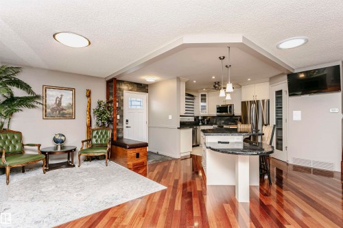 The property features hardwood flooring throughout the main living areas and kitchen - 9831 185 Street, Edmonton, AB - Indoor