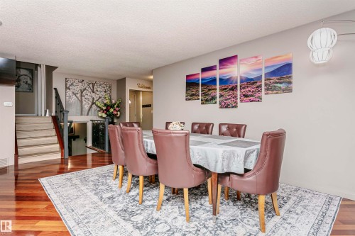 This dining area features glossy hardwood floors and a white ceiling - 9831 185 Street, Edmonton, AB - Indoor Photo Showing Dining Room