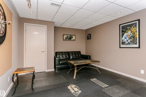This versatile room features neutral-toned walls, recessed lighting, and a drop ceiling - 9831 185 Street, Edmonton, AB - Indoor Photo Showing Other Room
