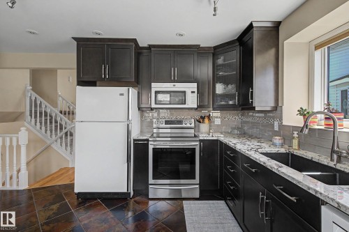 24 Elbow Drive, Devon, AB - Indoor Photo Showing Kitchen With Double Sink
