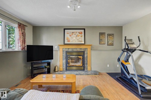 24 Elbow Drive, Devon, AB - Indoor With Fireplace