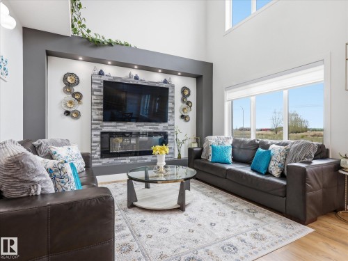 622 Astoria Way, Devon, AB - Indoor Photo Showing Living Room With Fireplace