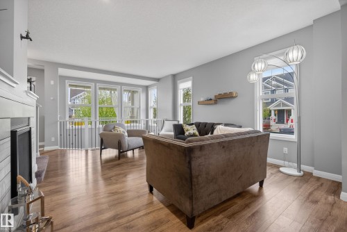 8416 23 Avenue, Edmonton, AB - Indoor Photo Showing Living Room With Fireplace