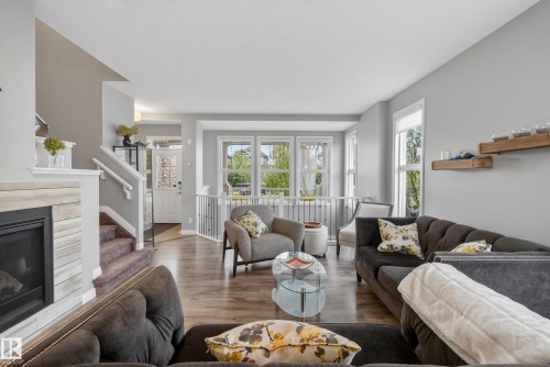 8416 23 Avenue, Edmonton, AB - Indoor Photo Showing Living Room With Fireplace