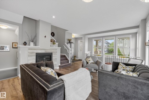 8416 23 Avenue, Edmonton, AB - Indoor Photo Showing Living Room With Fireplace
