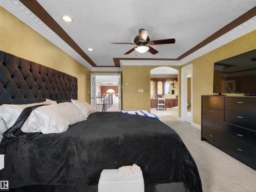 Carpeted room featuring a decorative ceiling fan, recessed lighting, and crown molding - 1511 69 Street, Edmonton, AB - Indoor Photo Showing Bedroom