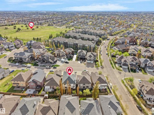 Aerial perspective showcasing a residential neighborhood with varied housing styles and ample green space - 1511 69 Street, Edmonton, AB - Outdoor With View