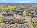 Aerial perspective showcasing a residential neighborhood with varied housing styles and ample green space - 1511 69 Street, Edmonton, AB  - Outdoor With View 
