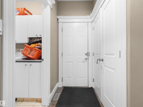 Entryway featuring a paneled door, crown molding, and baseboards - 1511 69 Street, Edmonton, AB - Indoor Photo Showing Other Room