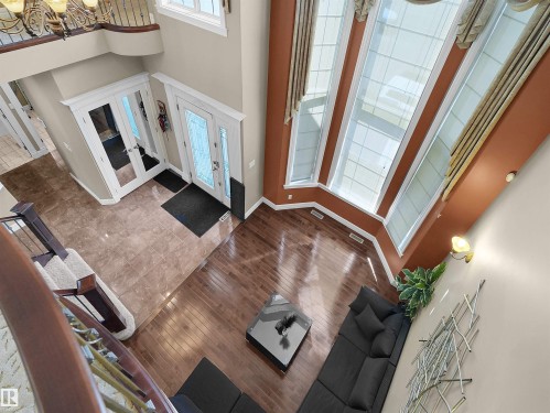 Foyer featuring marble-look tile flooring and double entry doors with decorative glass inserts - 1511 69 Street, Edmonton, AB - Indoor Photo Showing Other Room