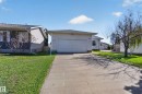 Single-story property featuring light-colored siding and an attached garage with a concrete driveway - 5204 55 Ave, Mundare, AB  - Outdoor 