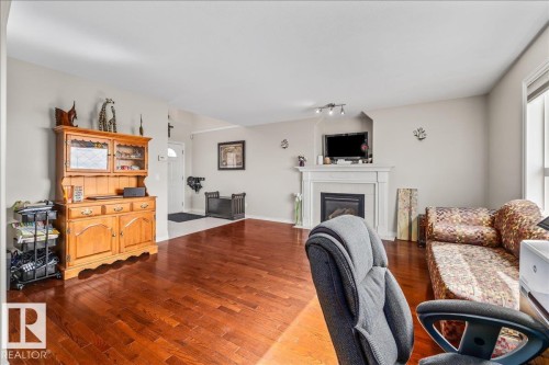 76 Napoleon Crescent, St. Albert, AB - Indoor Photo Showing Living Room With Fireplace