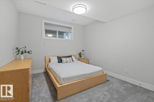 Neutral gray walls with white baseboards and trim, complemented by gray carpeting - 10611 146 Street Nw, Edmonton, AB - Indoor Photo Showing Bedroom