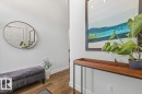 Light gray walls and wood-finish flooring create a refined aesthetic - 10611 146 Street Nw, Edmonton, AB  - Indoor Photo Showing Other Room 