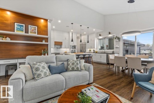 Open-concept living space featuring wood-finish flooring, a vaulted ceiling, and recessed lighting - 10611 146 Street Nw, Edmonton, AB - Indoor Photo Showing Living Room