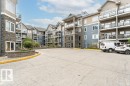 Multi-story condominium building featuring stone and siding exterior finishes - 145 10121 80 Avenue, Edmonton, AB  - Outdoor With Facade 