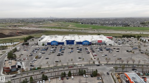Large-format retail building with extensive surface parking - 510 5151 Windermere Boulevard, Edmonton, AB - Outdoor With View