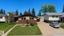 Bungalow-style residence featuring a brick and stucco facade with white-framed windows, a brown roof, and a concrete driveway - 1731 51 Street, Edmonton, AB  - Outdoor 