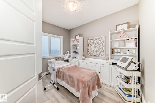 Spacious room featuring light wood-finish flooring and a neutral color palette - 38 Prospect Place, Spruce Grove, AB - Indoor