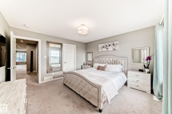Carpeted interior space with a light gray wall color and a recessed ceiling light fixture - 