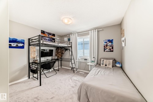 Carpeted room with a window, white window treatments, and light-toned walls - 38 Prospect Place, Spruce Grove, AB - Indoor