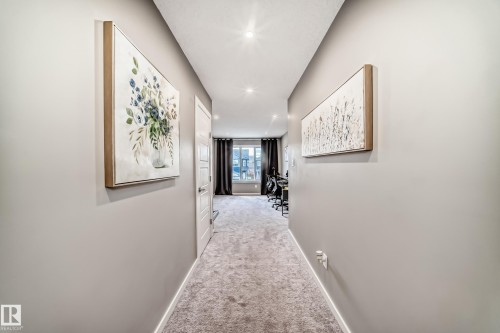 Carpeted hallway featuring light gray walls, white trim, and recessed lighting - 38 Prospect Place, Spruce Grove, AB - Indoor Photo Showing Other Room