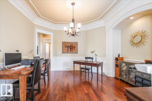 Room featuring rich wood-finish flooring, wainscoting, and crown molding - 2413 Tegler Green, Edmonton, AB - Indoor Photo Showing Office