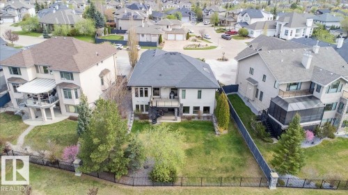 Rear exterior featuring a multi-level deck, a private balcony, and a walk-out patio - 2413 Tegler Green, Edmonton, AB - Outdoor
