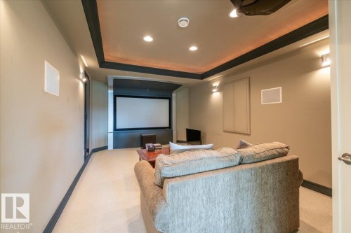 Dedicated media room featuring a large projection screen - 2413 Tegler Green, Edmonton, AB - Indoor Photo Showing Other Room