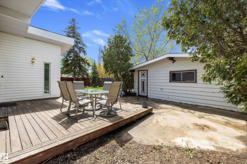 Expansive wood deck with a white vinyl-sided exterior - 11525 37A Avenue Nw, Edmonton, AB - Outdoor With Deck Patio Veranda With Exterior