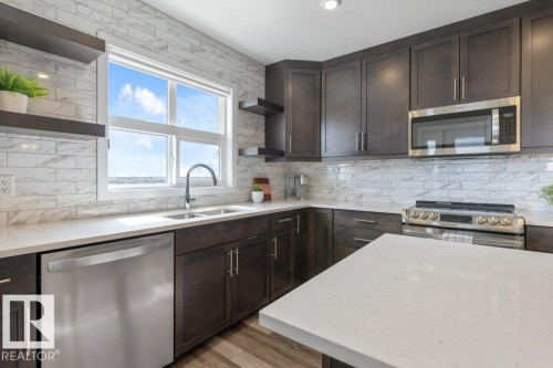 430 5504 Schonsee Drive, Edmonton, AB - Indoor Photo Showing Kitchen With Stainless Steel Kitchen With Double Sink With Upgraded Kitchen