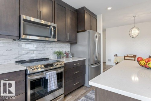 430 5504 Schonsee Drive, Edmonton, AB - Indoor Photo Showing Kitchen With Stainless Steel Kitchen With Upgraded Kitchen