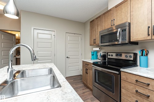 225 503 Albany Way, Edmonton, AB - Indoor Photo Showing Kitchen With Stainless Steel Kitchen With Double Sink