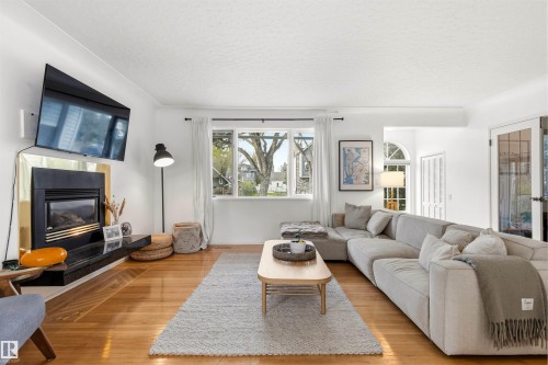 11415 73 Avenue, Edmonton, AB - Indoor Photo Showing Living Room With Fireplace