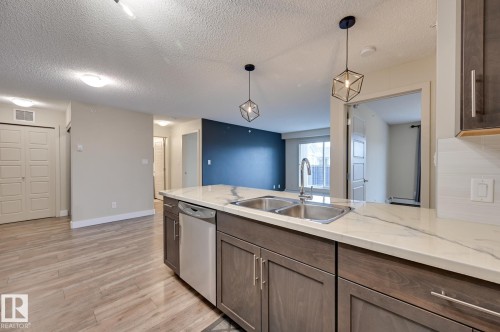 408 6084 Stanton Drive, Edmonton, AB - Indoor Photo Showing Kitchen With Double Sink