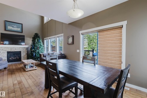 173 Sheppard Circle, Leduc, AB - Indoor Photo Showing Dining Room With Fireplace