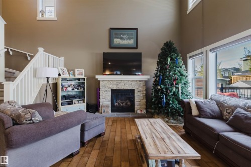 173 Sheppard Circle, Leduc, AB - Indoor Photo Showing Living Room With Fireplace